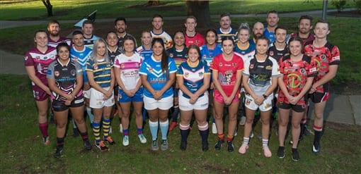 A women's rugby league squad in their club jerseys, lined up on a grassy field