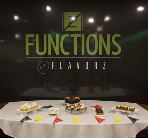 Functions @ Flavorz, with a table of cakes and bunting